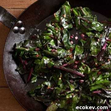 Sautéed beet greens in a cast iron skillet.