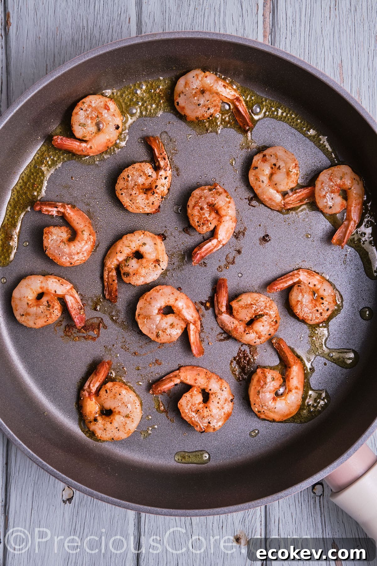 sauteed shrimp in a pan.