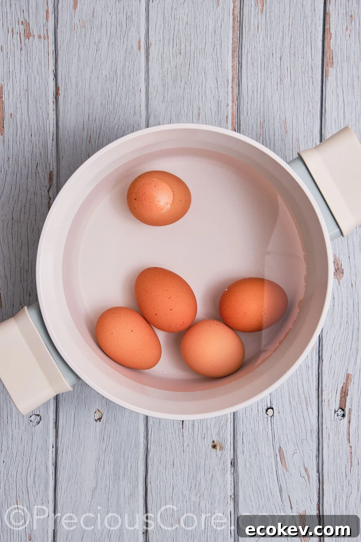 Eggs in a pot of water.