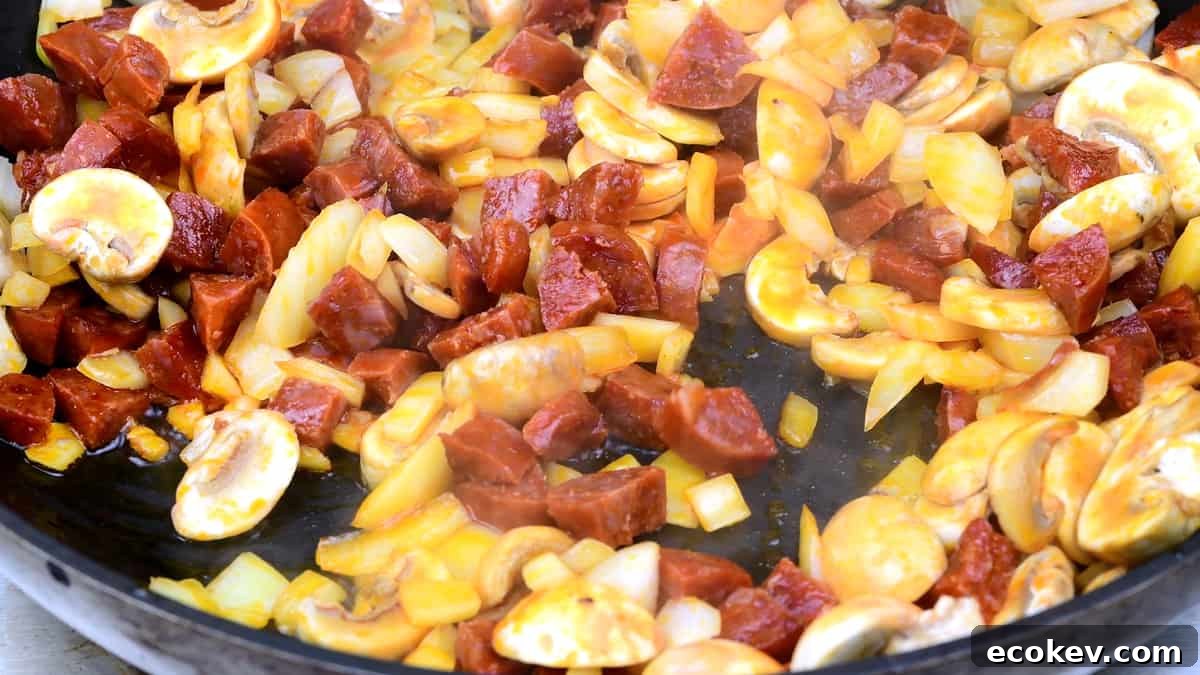 pan frying chorizo, onion and mushrooms