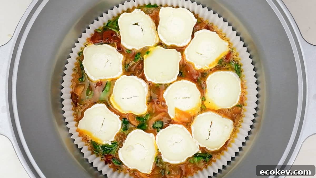 Crustless quiche topped with slices of goat's cheese