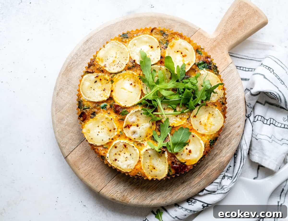 Slow cooker quiche with chorizo and goat's cheese on a wooden board
