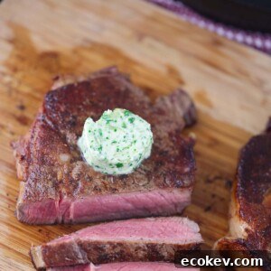 garlic herb compound butter on sliced steak.