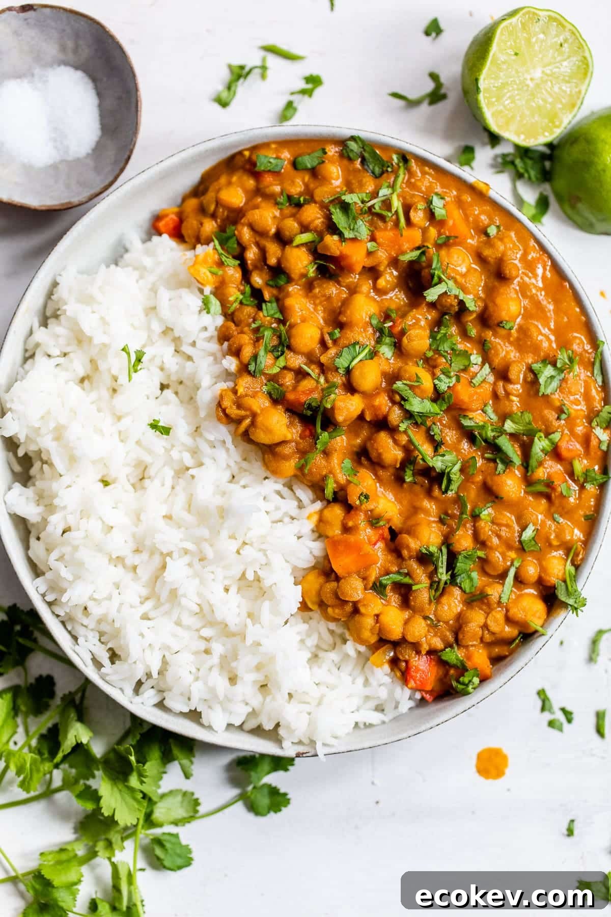 lentil curry in a bowl with basmati rice