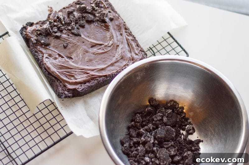 Spring Carrot Patch Brownies are a chocolatey, ooey-gooey, Oreo crumble-covered, Spring treat. These cute garden brownes are perfect to make for dessert on Easter, or for any Spring gathering.