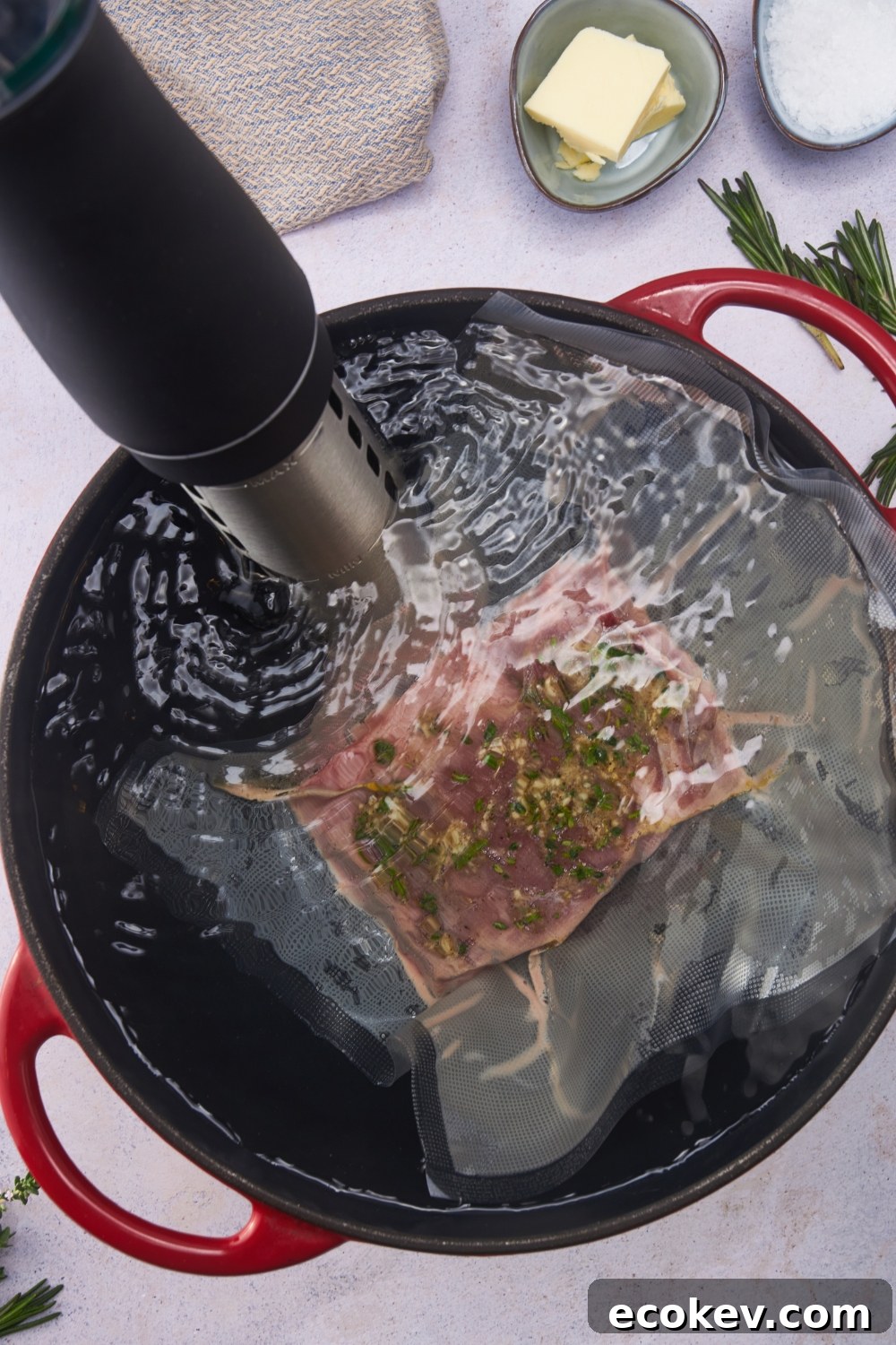 Beef tenderloin in a sous vide bag being cooked in a water bath.