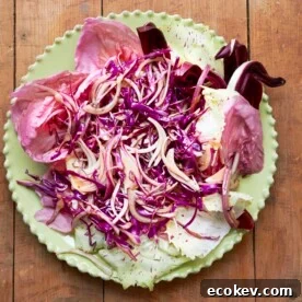 Red Salad with Radicchio, Citrus, Honey and Thyme Vinaigrette on a plate.