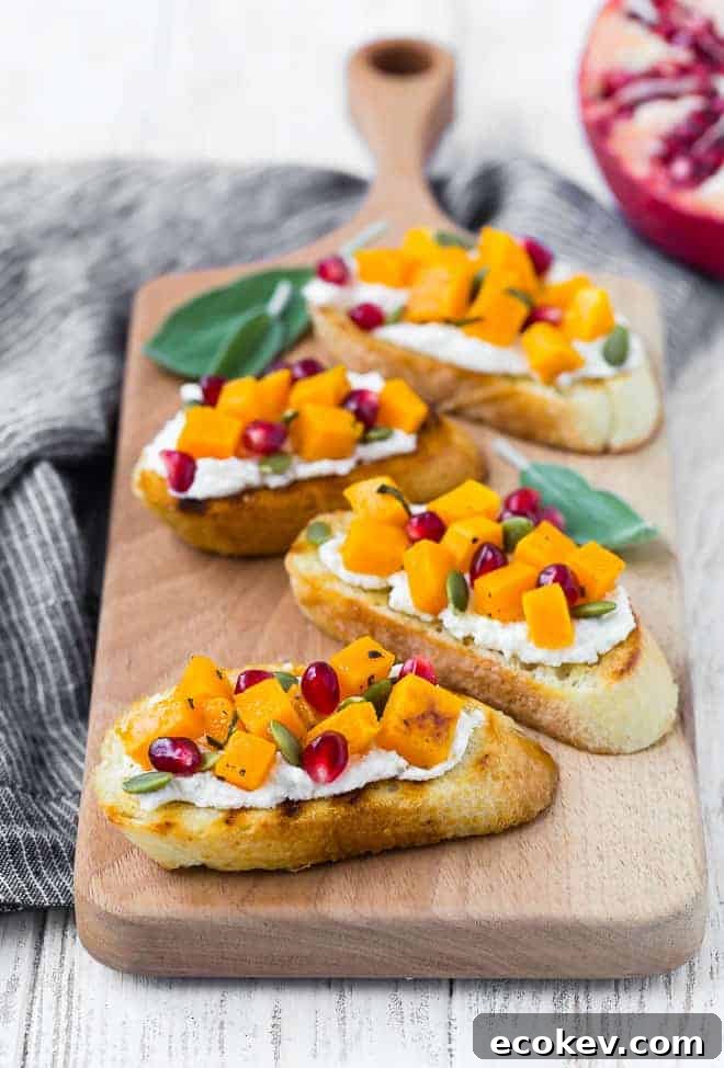 Crostini with squash, pomegranate, ricotta, and pepitas.
