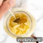 a top down view of sauerkraut in a mason jar.