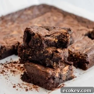 Three chocolate sourdough peanut butter brownies stacked on top of each other.