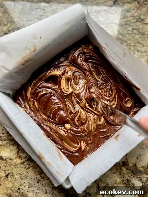 Swirled peanut butter in batter.