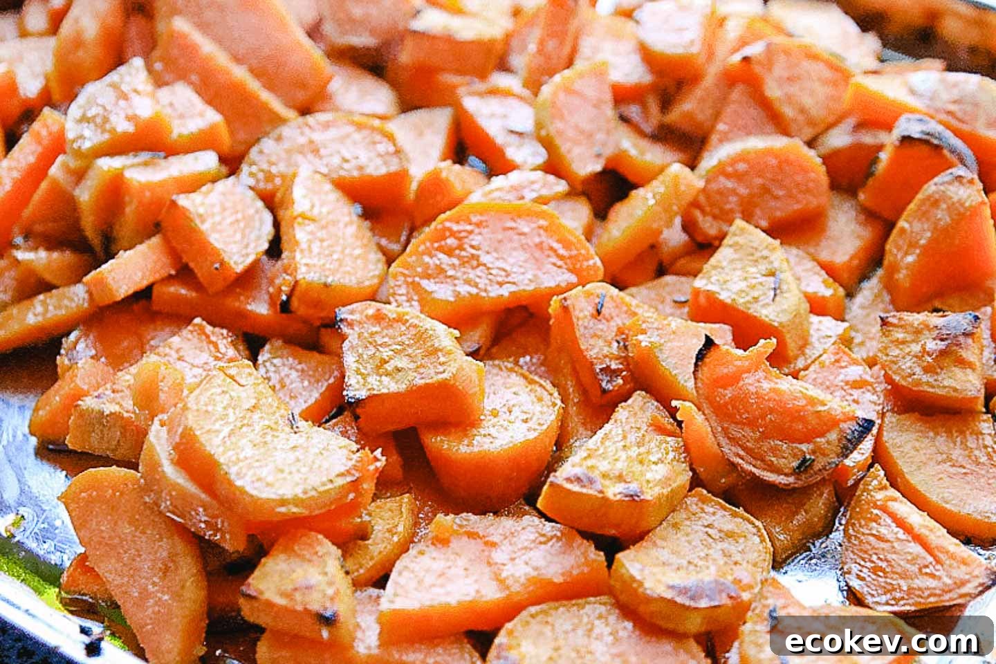Roasted sweet potatoes on a baking sheet.