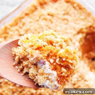 sweet potato casserole on a wooden spoon.
