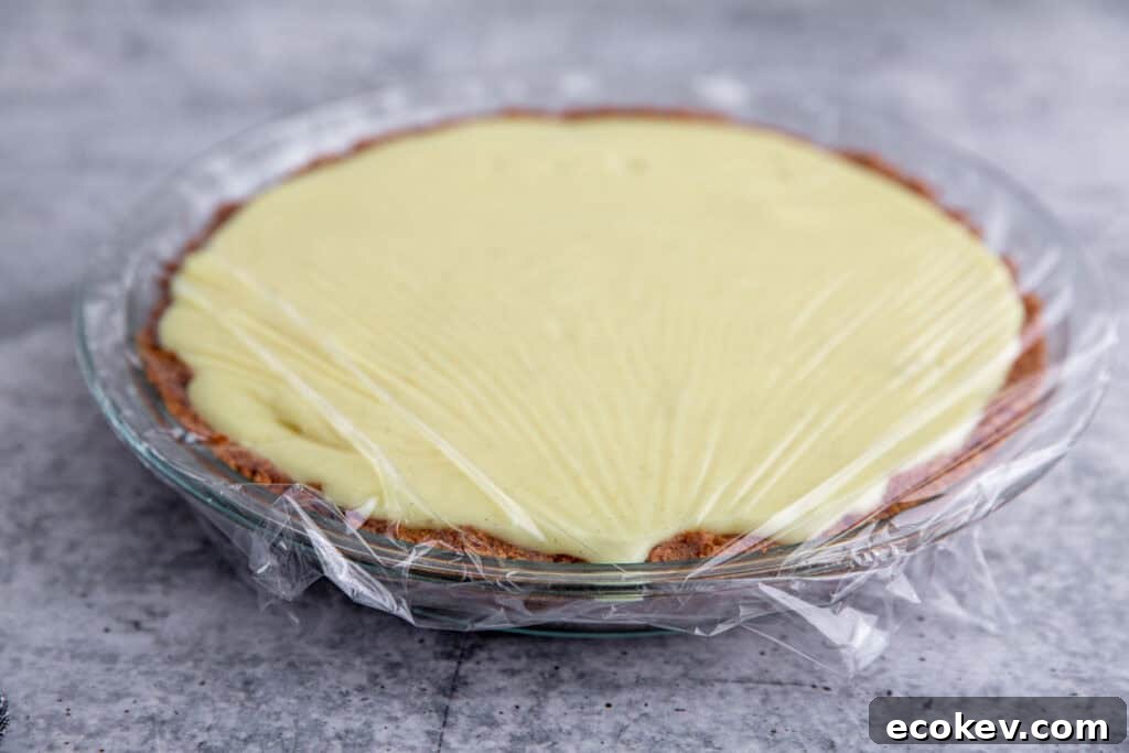 custard poured into the pie plate and wrapped with plastic wrap