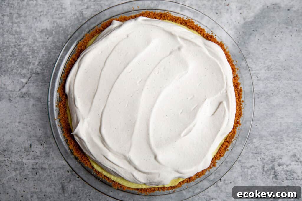 whipped cream spread over the top of the pie