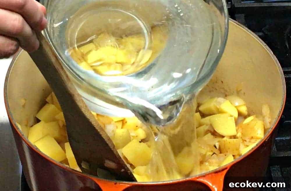 Adding Potatoes and Water to Soup