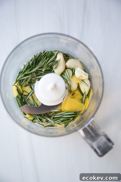 garlic rosemary and lemon zest in a food processor bowl