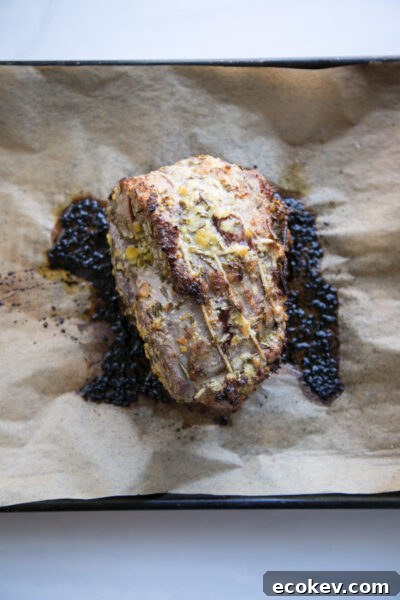sheet pan with oven roasted leg of lamb boneless and tied