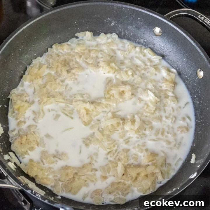 Garlic, butter, onions, flour and milk in a pan.