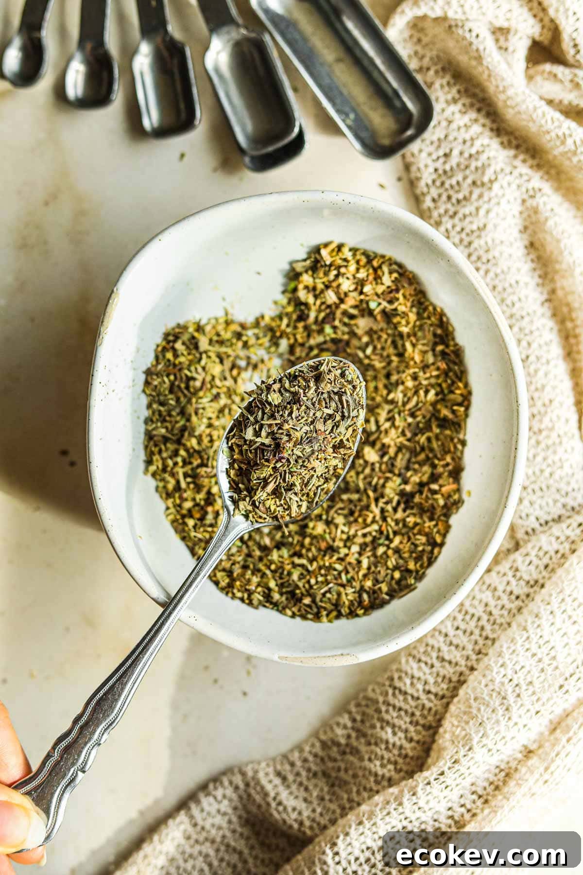 Mix dried basil, parsley, thyme, rosemary, and oregano in a bowl to make Italian seasoning.
