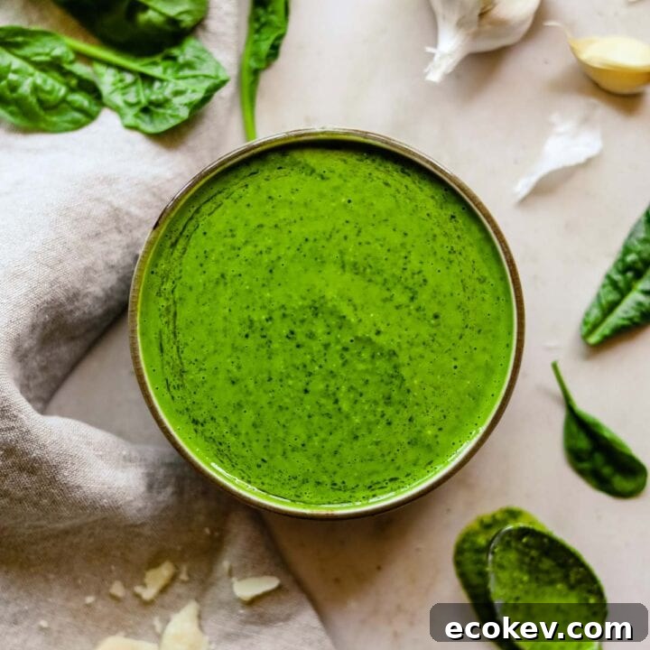 Bright and creamy spinach pesto in a bowl.