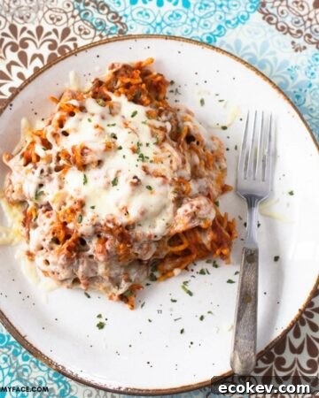 A serving of Crock Pot Cheesy Beef Spaghetti on a plate.