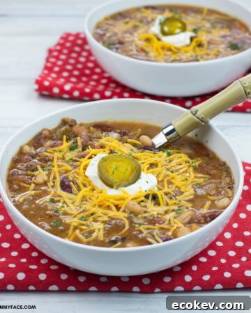 serving Tex Mex 15 Bean soup in a white bowl, on a red cloth napkin