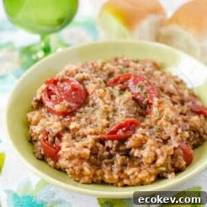 A green bowl filled with an serving of Italian Ground beef and rice casserole.