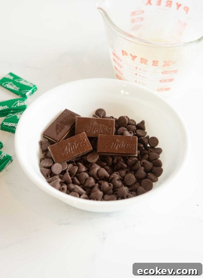 white bowl of chocolate chips and andes mint candies