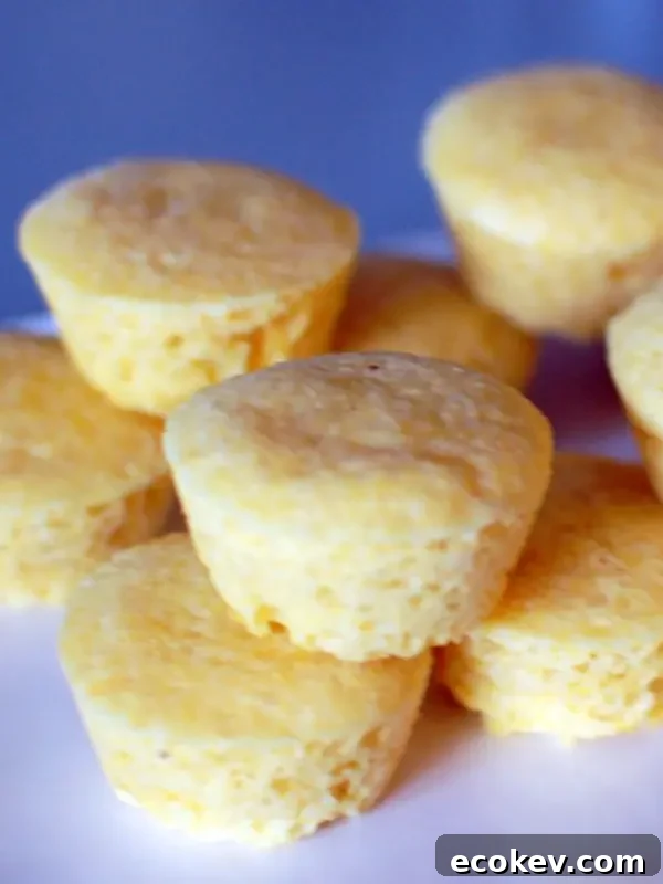 Vegan Goat Cheese Corn Muffins stacked on a platter