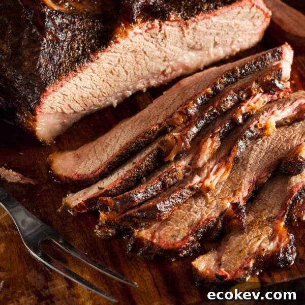 A smoked brisket sliced on a cutting board.