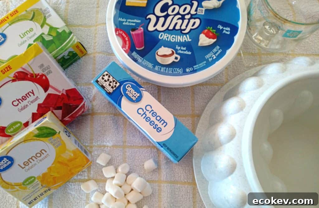 Ingredients: Lime, Cherry, and Lemon Jello, cream cheese, Cool Whip, and marshmallows.