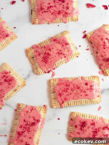 chocolate pop tarts with strawberry glaze on a white marble counter