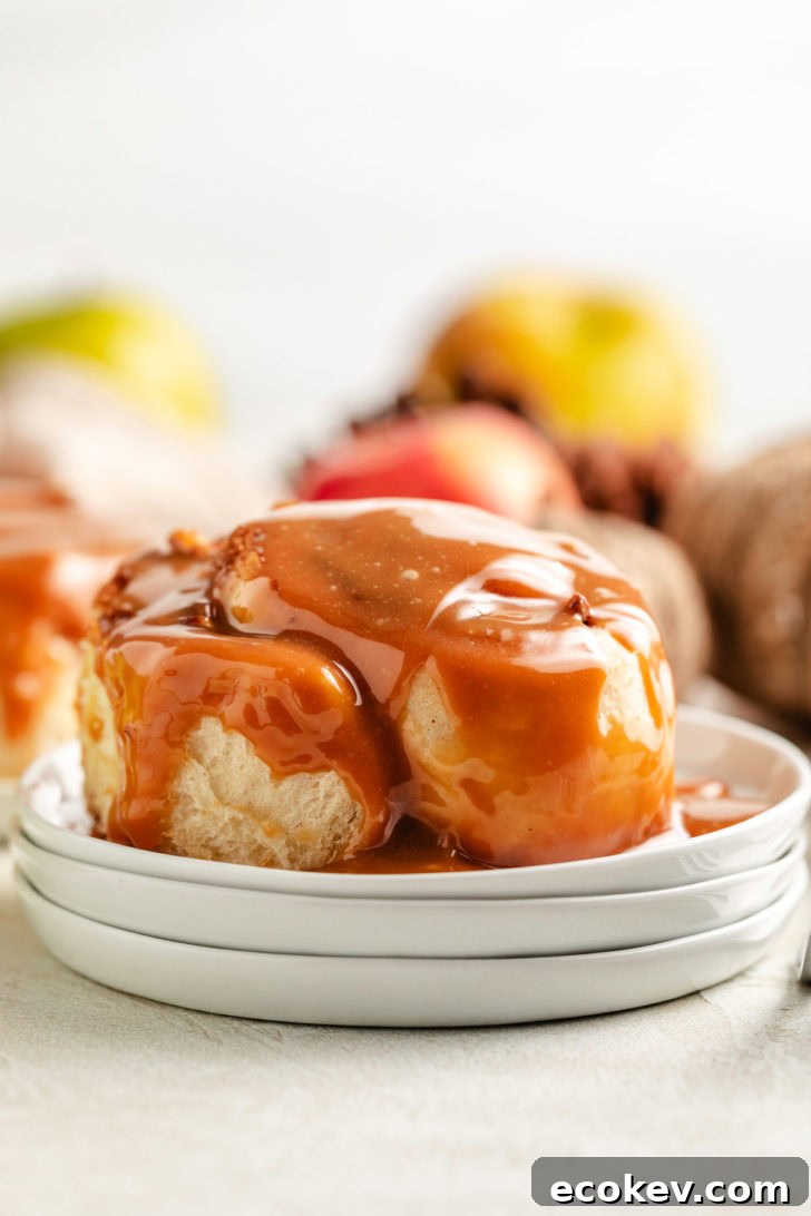 Caramel sauce over a cinnamon roll.