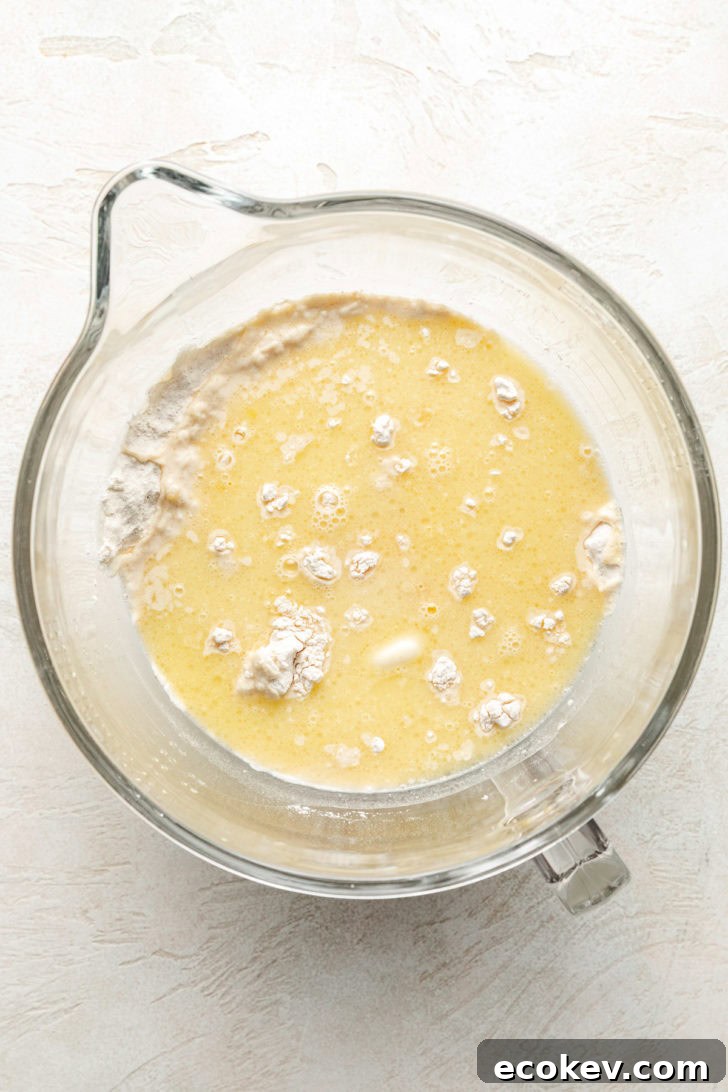 Ingredients for cinnamon roll dough in a bowl.