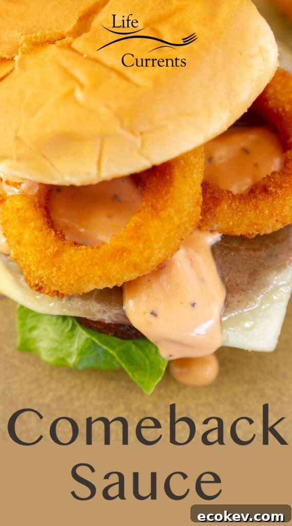 looking down on a burger with onions rings, cheese, and lettuce, title on bottom: Comeback Sauce.