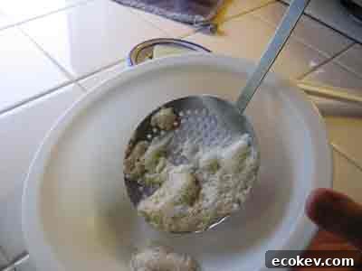 Dump scum out into a bowl to be discarded.