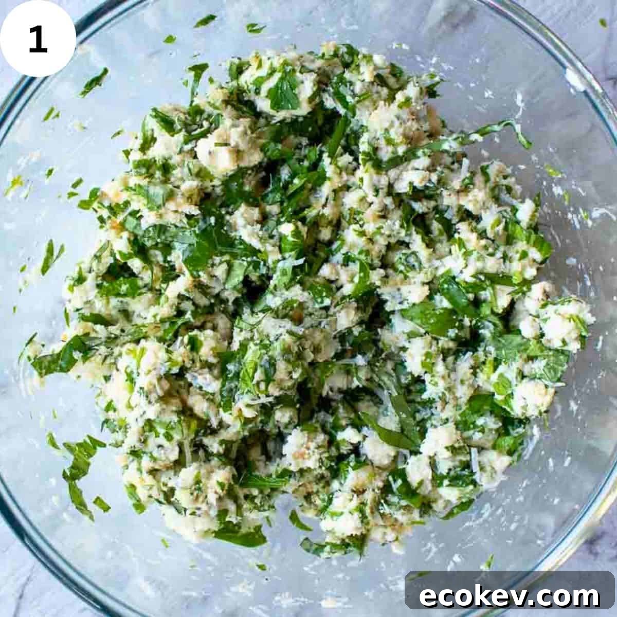 Ricotta cheese and herb filling in a bowl.