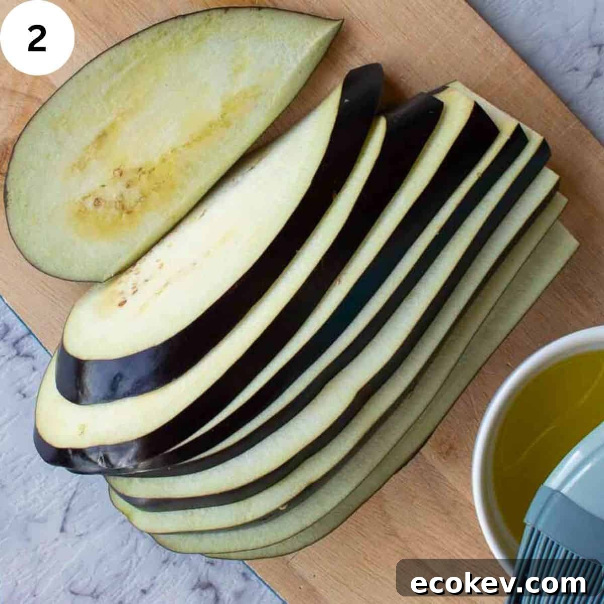 An eggplant sliced lengthwise.