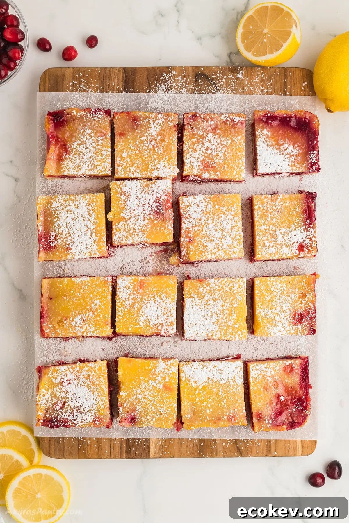 An overhead image of a slap of lemon bars cut into squares.