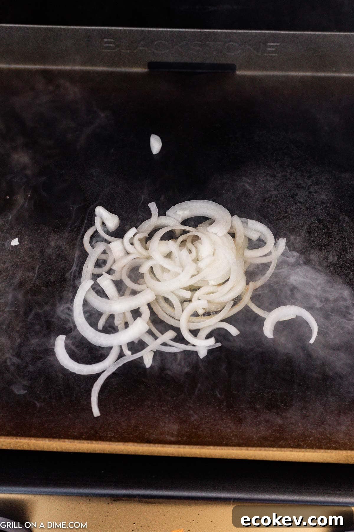 Cooking chopped onions on the griddle