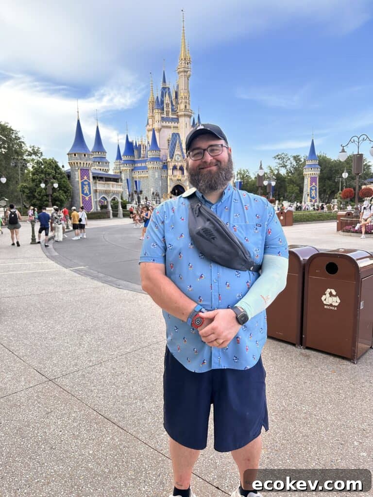 Chad in a RSVLTS shirt in front of Cinderella's Castle at Magic Kingdom.