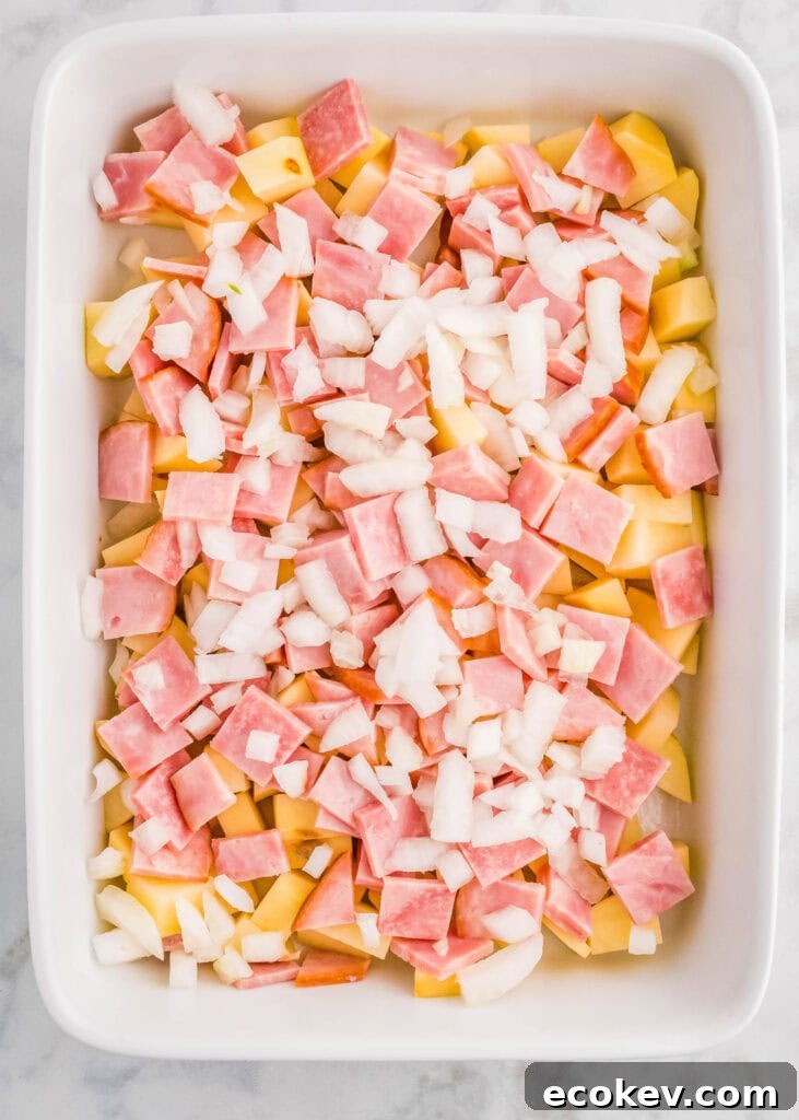 layering ham potatoes and onions in casserole dish