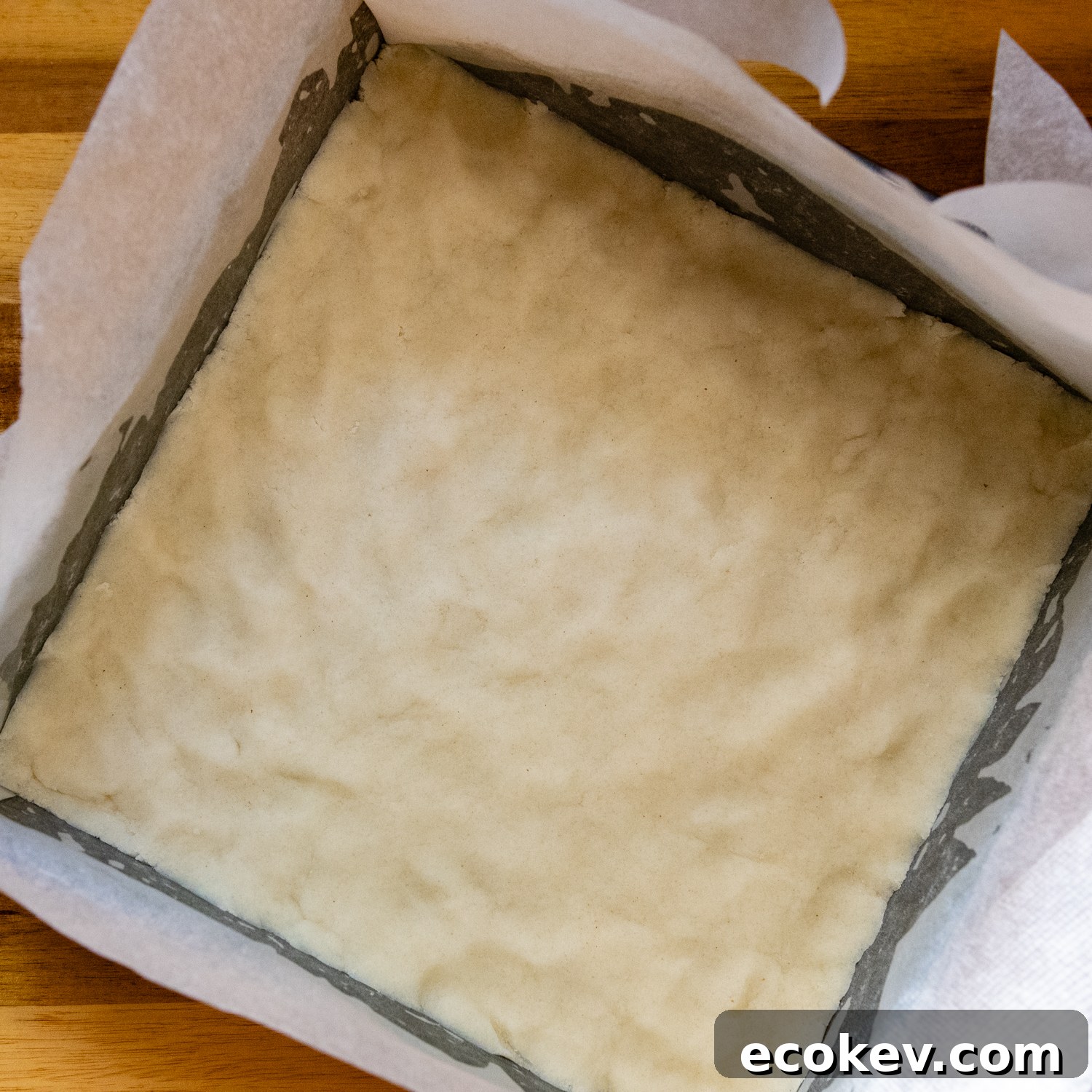 Dough pressed into prepared baking pan.