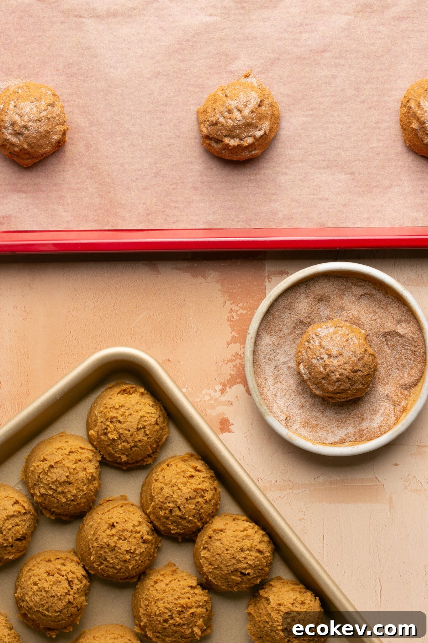 cookie dough being rolled in cinnamon and sugar. 