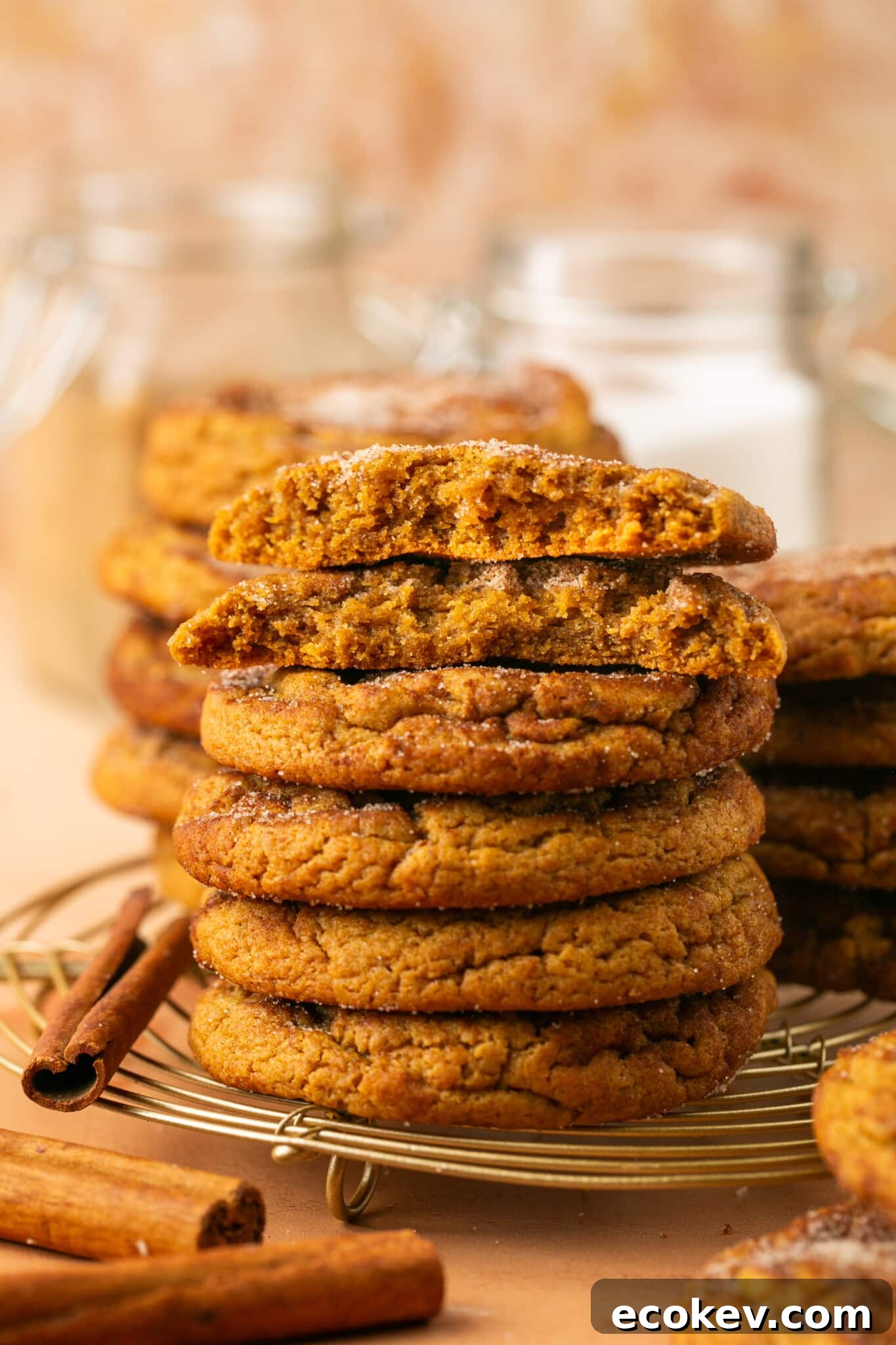 a stack of cookies on a wire cooling rack. 