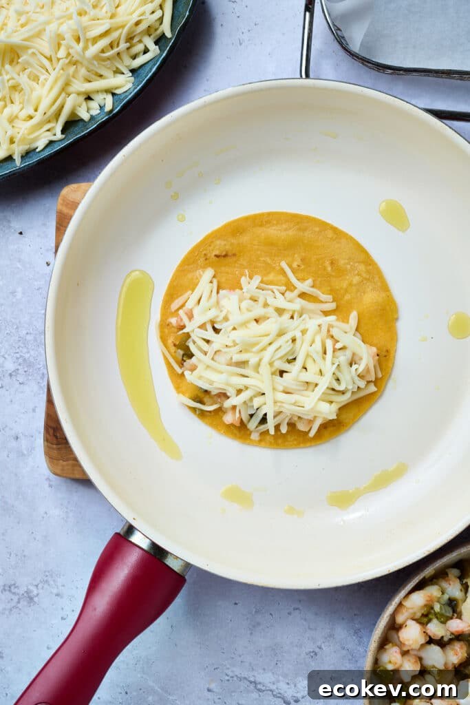 Crispy tortilla topped with shrimp and cheese.
