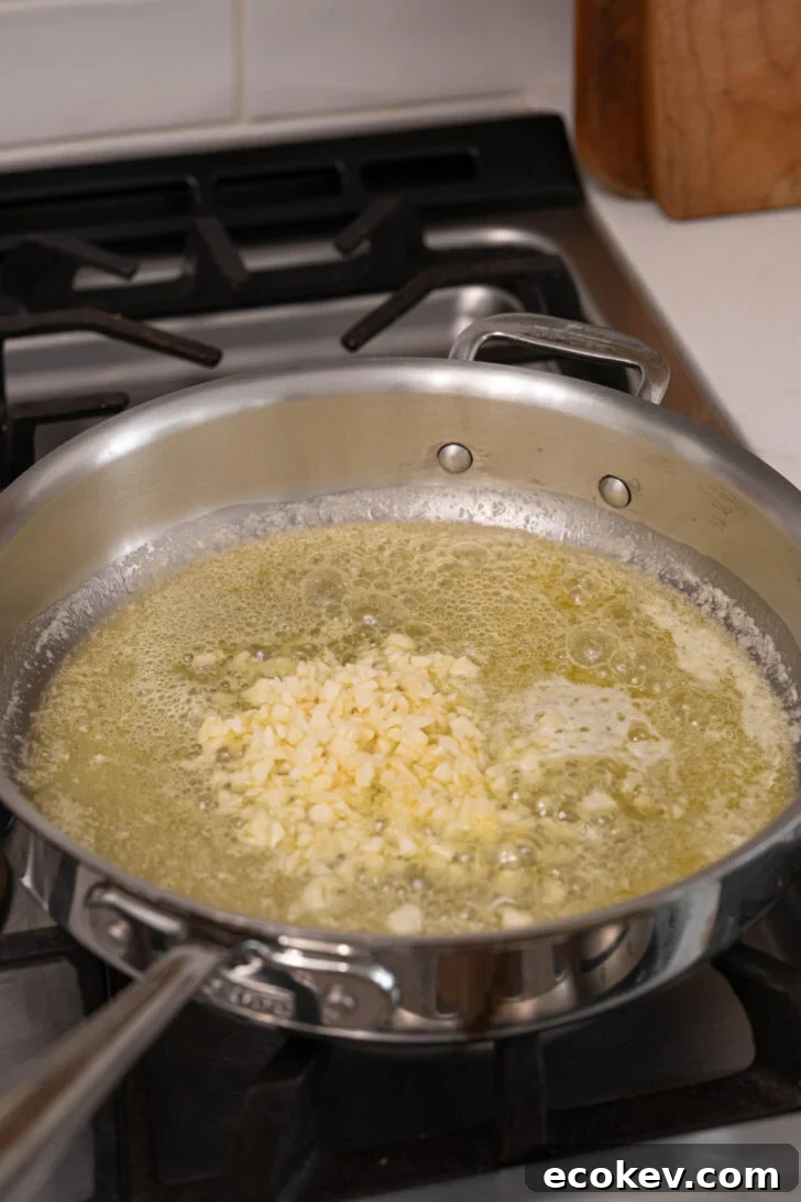A pan with butter and garlic.