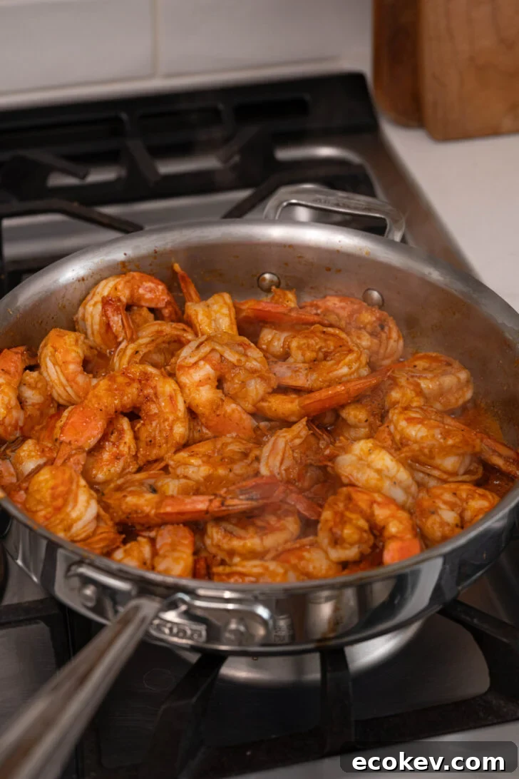 A pan with garlic butter shrimp.
