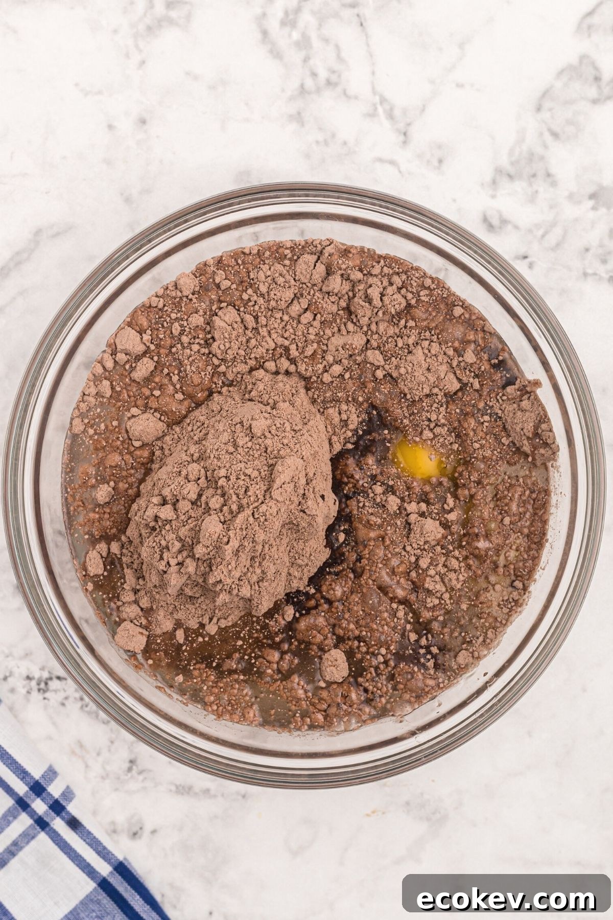 Cake mix in a clear glass bowl before being mixed.